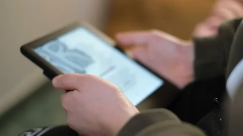School boy kid using digital ebook reader at home,new book reading technology Stock Footage 146241836