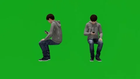 School boy playing and watching a movie with his mobile phone sitting on a gre Stock-Footage 198146416