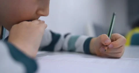 School boy practicing writing the alphabet at home Stock Footage 167795252