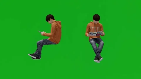 School boy reading a textbook sitting on a green screen with 2 different views Video stock 198146420