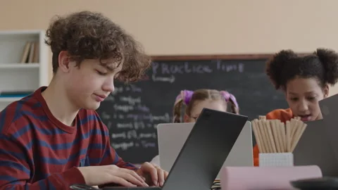 School Boy Trying to Understand Programming during Class Stock Footage 248530868