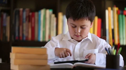 School boy using digital tablet beeing surprised Stock Footage 46025575