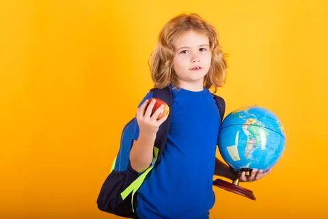School boy world globe and apple. Nerd school kid isolated on studio background Foto stock