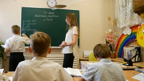 School boy writing on the blackboard Stock Footage 93889776