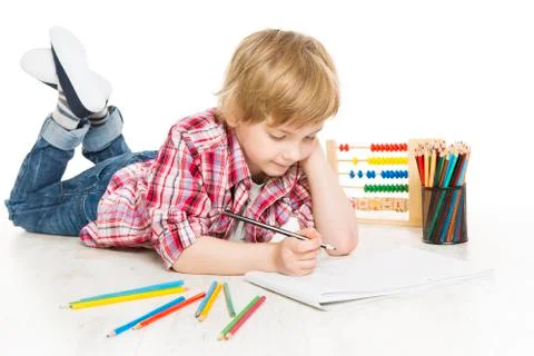 School boy writing exercise in notebook. Schoolboy do a sum of mathematics Stock Photos