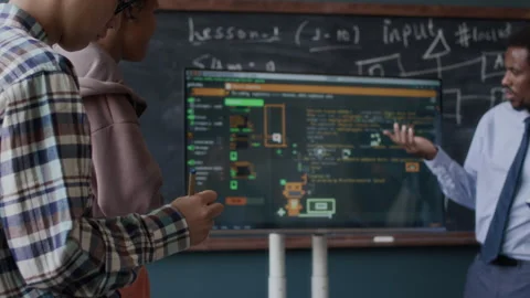 School Boys at Programming Lesson with African American Teacher Stock Footage 284430128