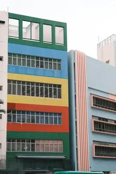 School building with rainbow colored striped facade in Hong Kong Stock Photos