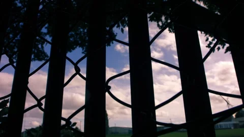 School building through view of secure fence Stock Footage 346720712