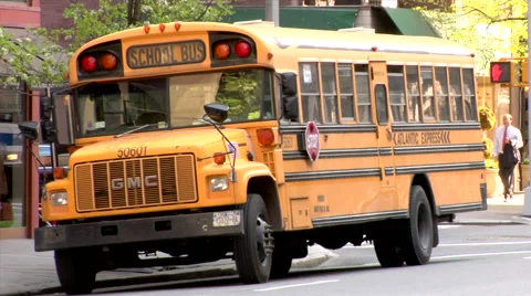School Bus Blinking Lights unloading students street corner New York Stock Footage 49223841