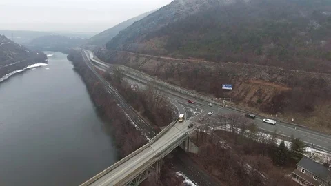 School bus cross bridge in valley Stock Footage 71697922