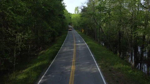 School bus down county road Видео 239075697