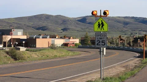 School Bus drives through a School Zone. Video stock 23817965