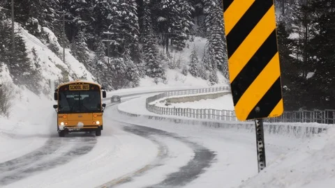 School Bus Driving During A Snow Storm Stock Footage 123042997