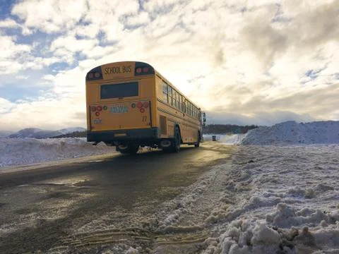School Bus Driving In Snow Stock Photos