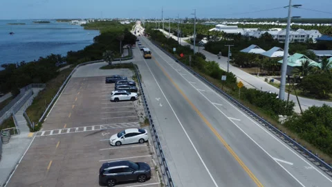 School bus leaving Marathon Key on the Seven Mile Bridge Stock Footage 343900605