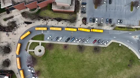 School bus line at school with students ... | Stock Video | Pond5