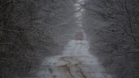 School bus rides through the winter forest. Stock Footage 124846913