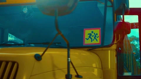 School bus safety sign on front windshield cinematic yellow vehicle clip Stock-Footage 341969497