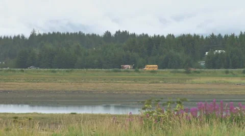 School Bus on Slough Road - cloudy day Stock Footage 8559021