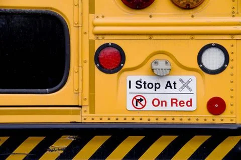 School Bus A warning sign on the back of the schoolbus Copyright: xZoonar.... Stock Photos