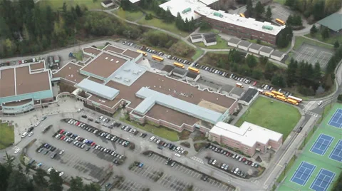 School Buses Leaving Public School - Aerial Stock Footage 34654088