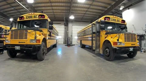 School Buses Parked in the garage Stock Footage 56776259