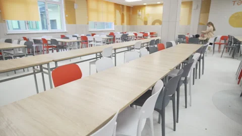 School cafeteria features light tables and ergonomic chairs Vídeos de archivo 310245306