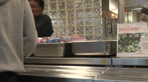 School cafeteria line with students selecting food 動画素材 40030748