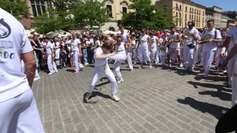 The school of capoeira performing during Dragons Parade in Cracow, Poland Stock Footage 245572520