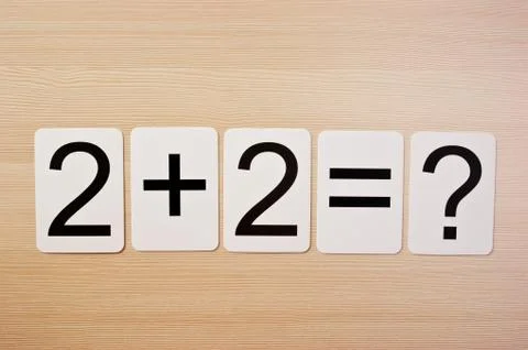 School card  with math problems on the table Stock Photos