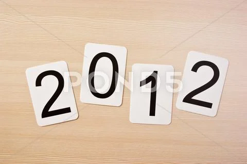 School card with new year 2012 on the table Stock Photos