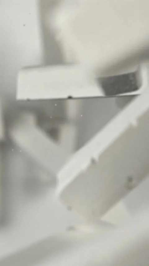 School chalk flying on a white background. Filmed on a high-speed camera at 1000 Stock Footage 335379675