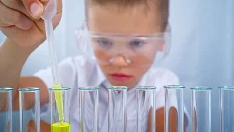 At school, in a chemistry lesson, one boy did an experiment in the laboratory. Stock Footage 282593727