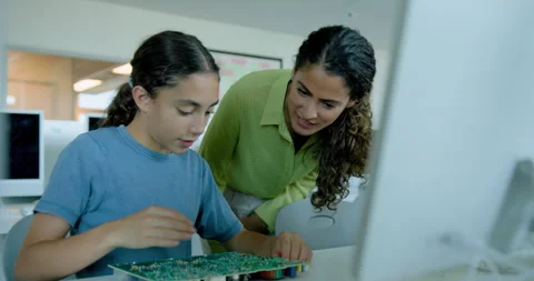 School Child in STEM Computer Classroom Looking at Motherboard Technology with Stock Footage 286049411