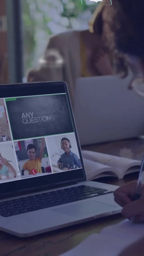 In school, child taking notes during online class with animation on screen Stock Footage 344370392