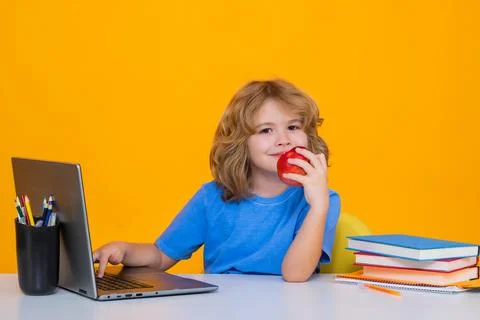 School child using laptop computer. School kid student learning, study language Stock Photos