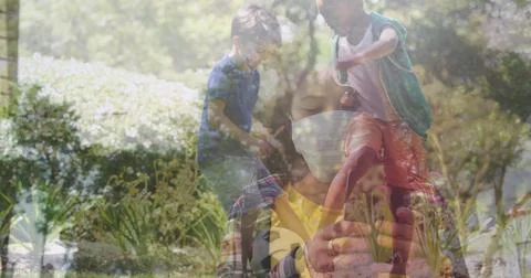 In school, child using smartphone while Asian woman observes screen Illustrazione stock