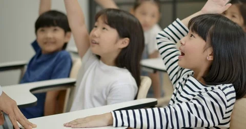 School children answer questions in class. Stock Footage 112574225