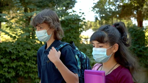 School children with face mask going back to school after covid-19 lockdown. 4k Stock Footage 139755359