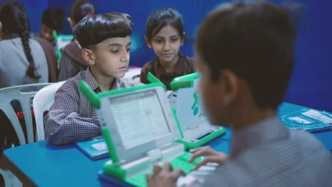 School children in Karachi, Pakistan using small laptops in a classroom. Modern Stock Footage 330979076