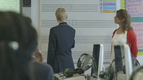 School children learning music Stock Footage 32697098