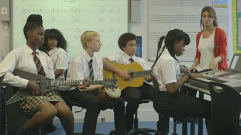 School children learning music Stock Footage 32697122