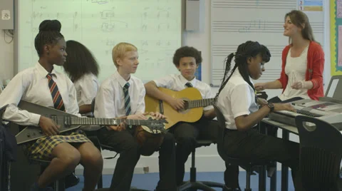 School children learning music Stock Footage 32697138