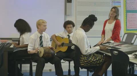 School children learning music Stock Footage 32697160