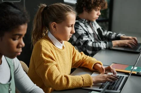 School children learning to use computers Stock Photos