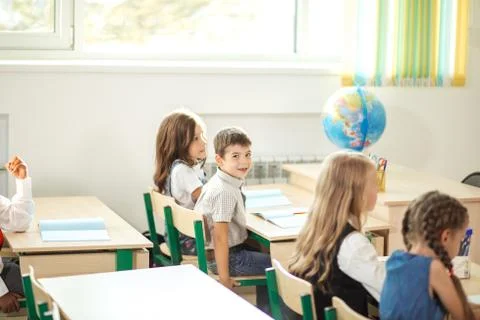 School children participating actively in class. Education, learning, high Stock Photos