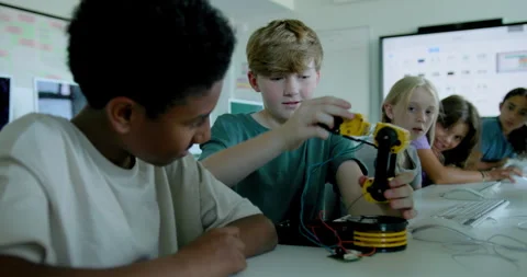 School Children in STEM Computer Classroom, Looking at Robot arm Stock Footage 286046337