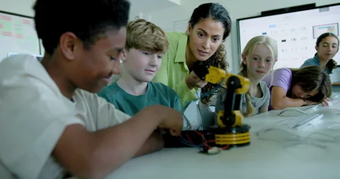 School Children in STEM Computer Classroom, Looking at Robot arm with Teacher Stock Footage 286090108