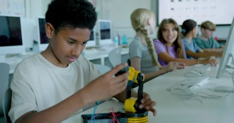 School Children in STEM Computer Classroom, Looking at Robot arm Stock Footage 286090244