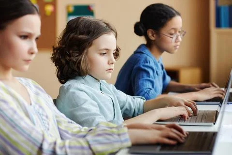 School children using computers in class Stock Photos